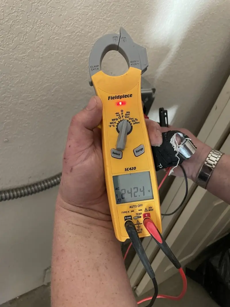 Voltage testing with clamp meter during Recessed Lighting Installation in Springhill